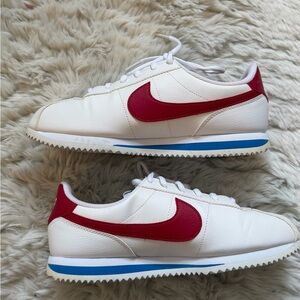 Nike White Sneakers with Red Swoosh and Blue Midsole Stripe